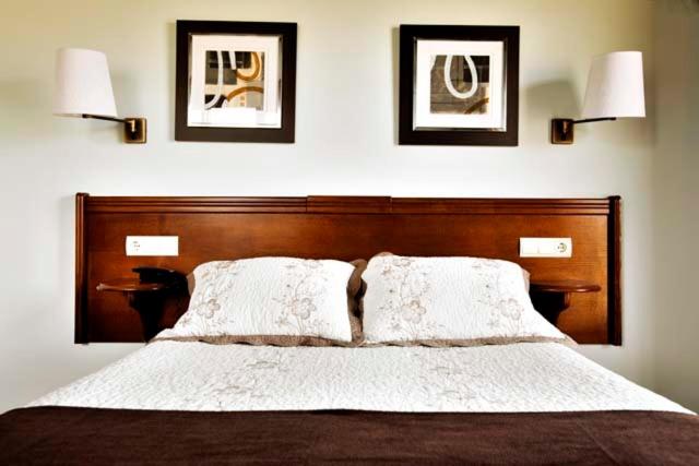 Cama o camas de una habitación en Hotel & Spa Villa de Mestas