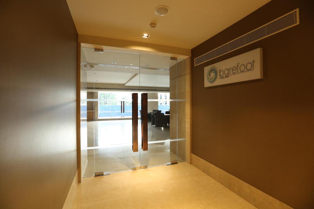 an office hallway with a sign on the wall at Feathers- A Radha Hotel, Chennai in Chennai