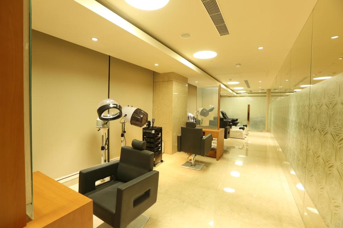 an office with a hair salon with a waiting room at Feathers- A Radha Hotel, Chennai in Chennai