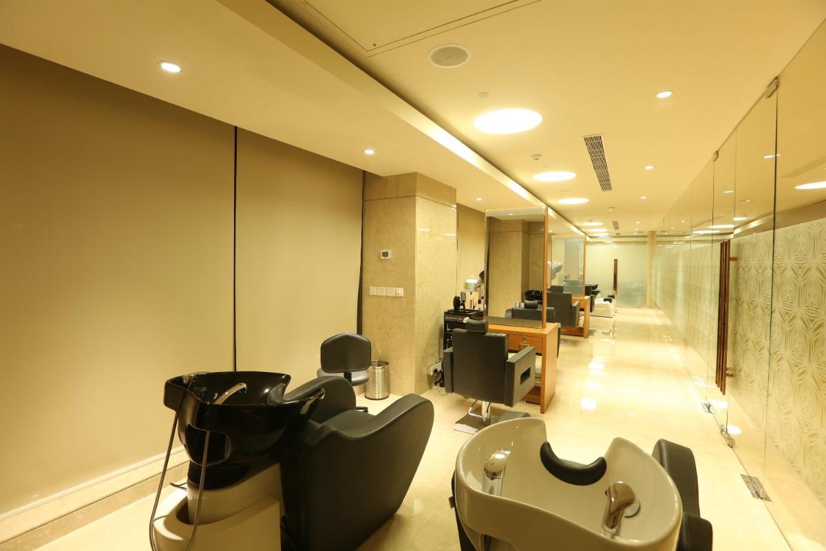 an office with desks and chairs in a room at Feathers- A Radha Hotel, Chennai in Chennai