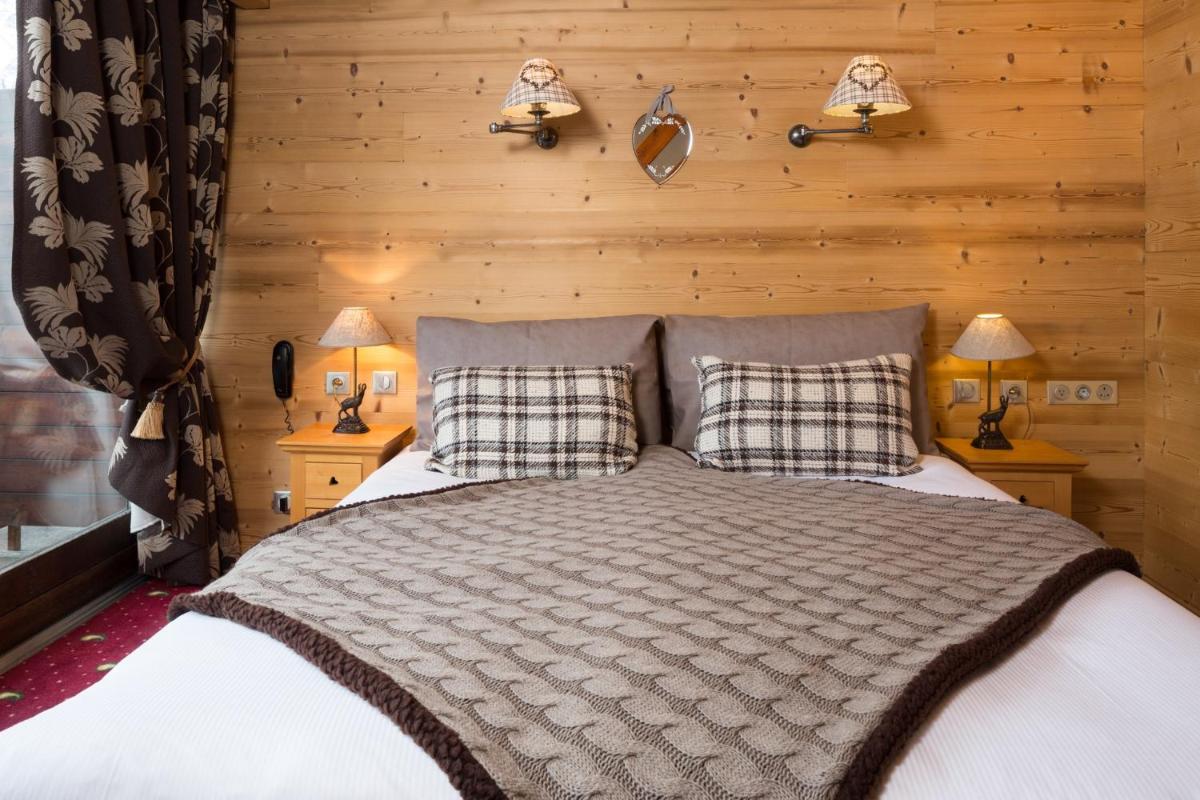 Un ou plusieurs lits dans un hébergement de l'établissement Les Grands Montets Hotel & Spa