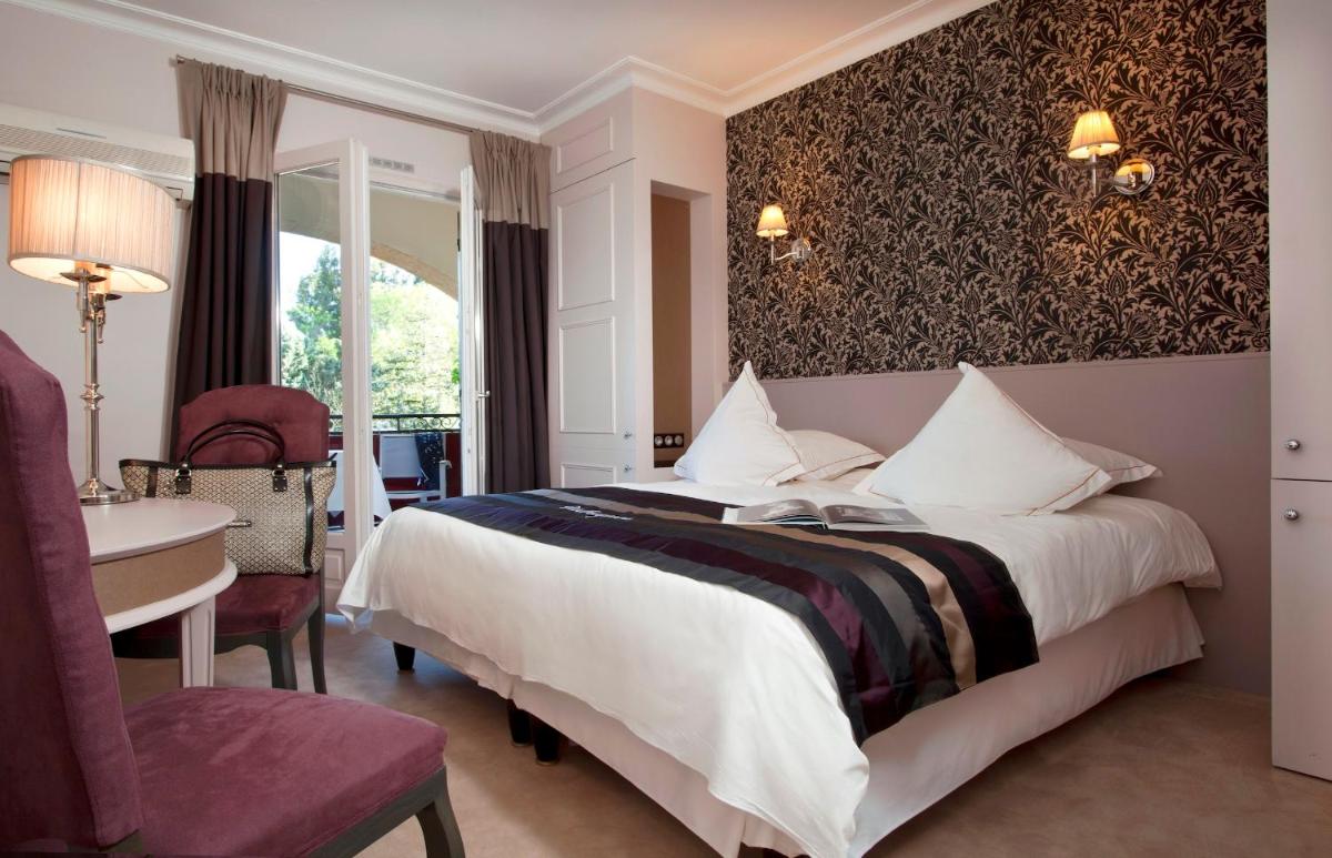 Un ou plusieurs lits dans un hébergement de l'établissement Le Vallon de Valrugues Hotel Spa & Villas