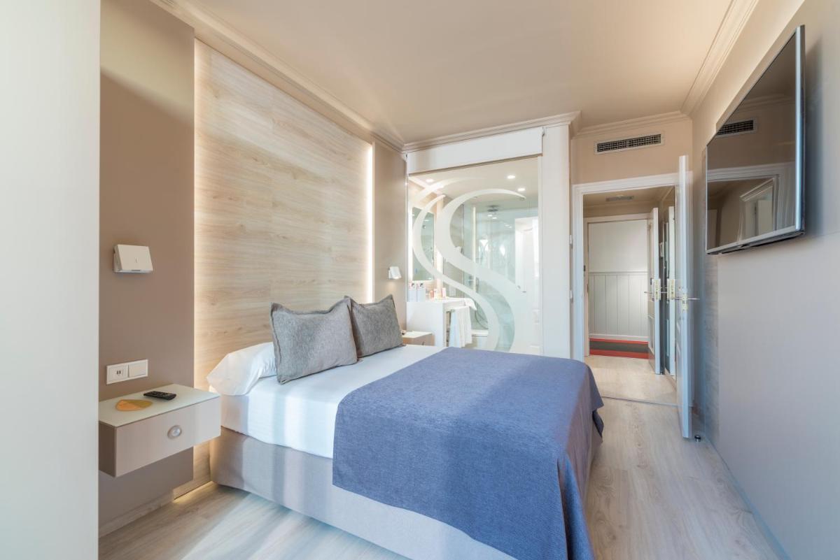 Cama o camas de una habitación en Sallés Hotel Pere IV