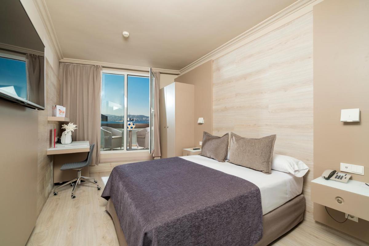 Cama o camas de una habitación en Sallés Hotel Pere IV