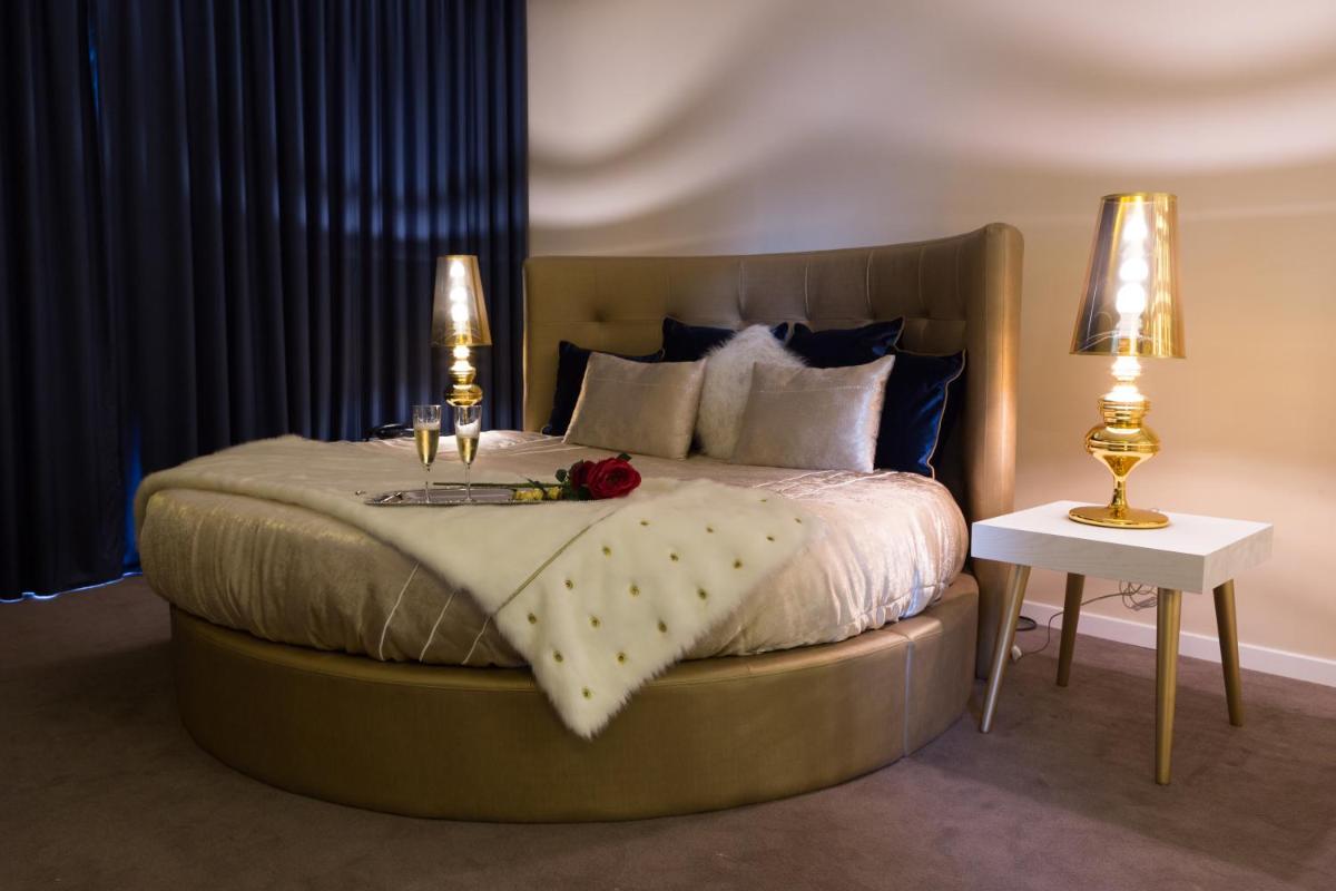 Uma cama ou camas num quarto em Hotel de Ilhavo Plaza & Spa