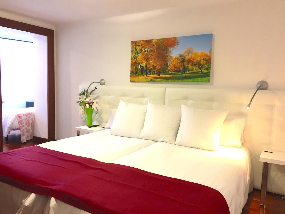 Cama o camas de una habitación en Hotel Del Lago