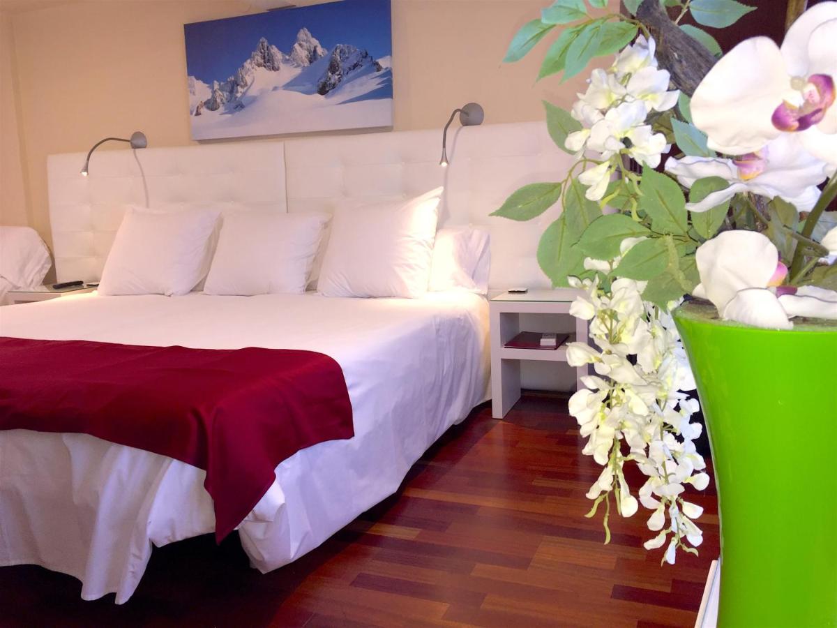 Cama o camas de una habitación en Hotel Del Lago
