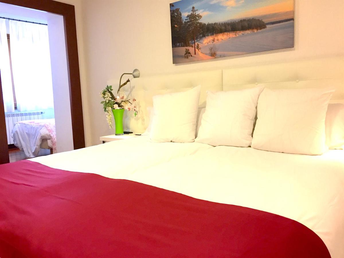 Cama o camas de una habitación en Hotel Del Lago
