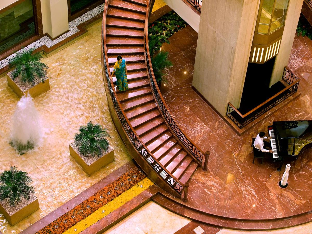 an overhead view of a spiral staircase in a building at The Lalit Mumbai in Mumbai