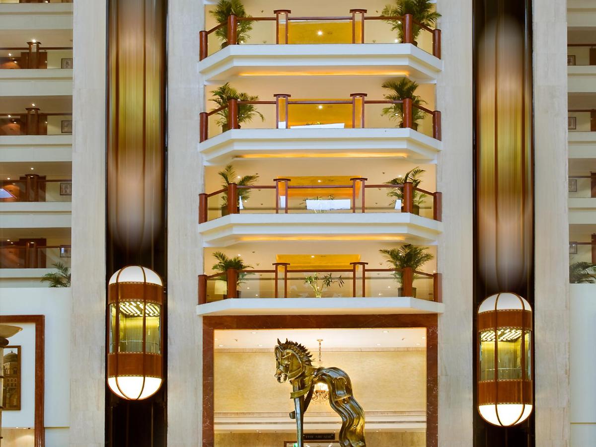 a building with a horse statue in front of it at The Lalit Mumbai in Mumbai