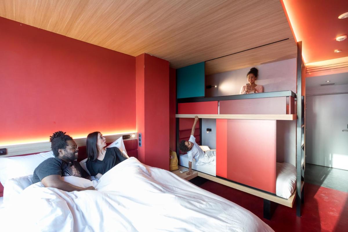 Un ou plusieurs lits dans un hébergement de l'établissement YOOMA Urban Lodge Tour Eiffel