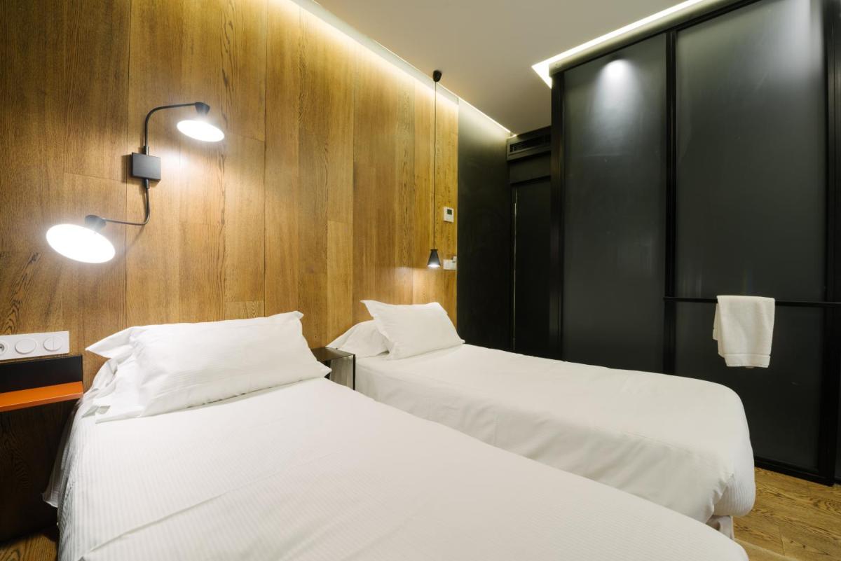 Un ou plusieurs lits dans un hébergement de l'établissement Atypik Hotel