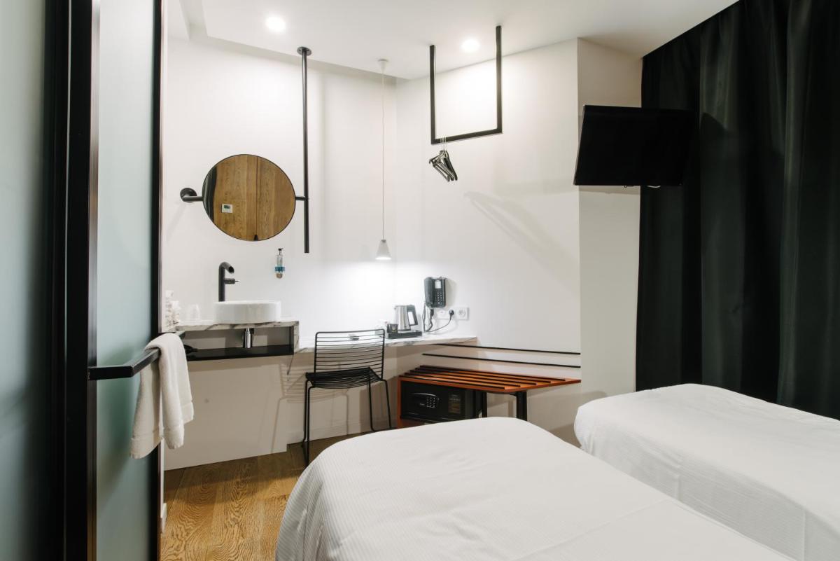 Un ou plusieurs lits dans un hébergement de l'établissement Atypik Hotel