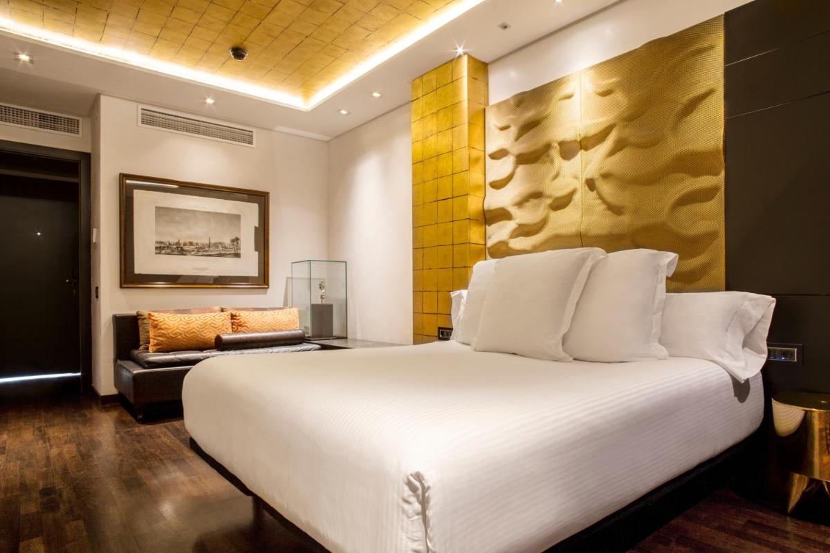 Cama o camas de una habitación en Claris Hotel & Spa GL, a Small Luxury Hotel of the World