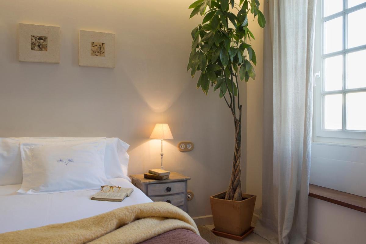 Cama o camas de una habitación en Jardí de Ses Bruixes Boutique Hotel