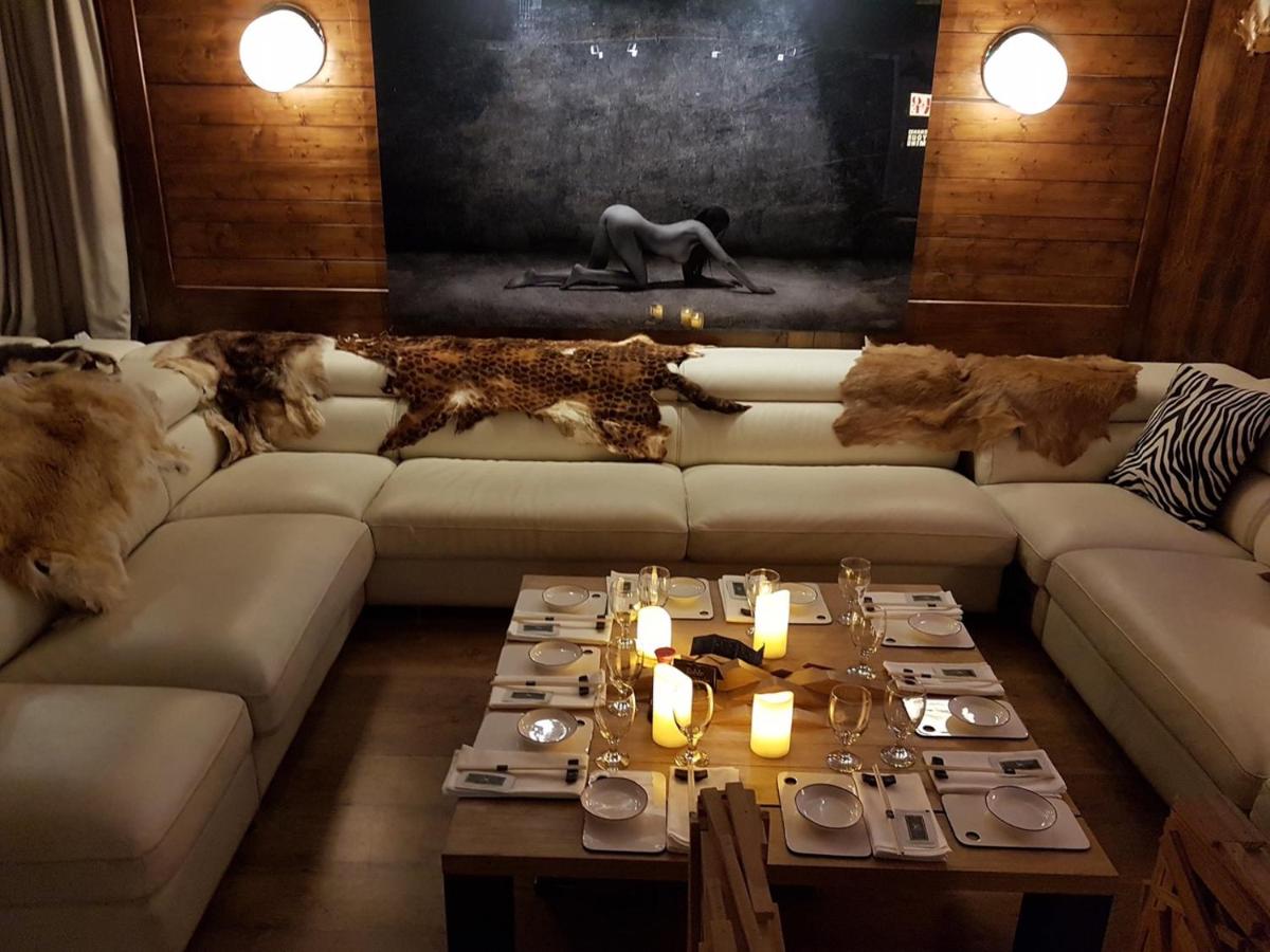 Coin salon dans l'établissement Snow Lodge Hotel Courchevel 1850
