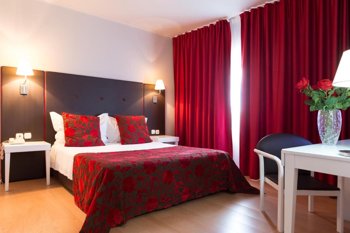 Uma cama ou camas num quarto em Hotel de Ilhavo Plaza & Spa