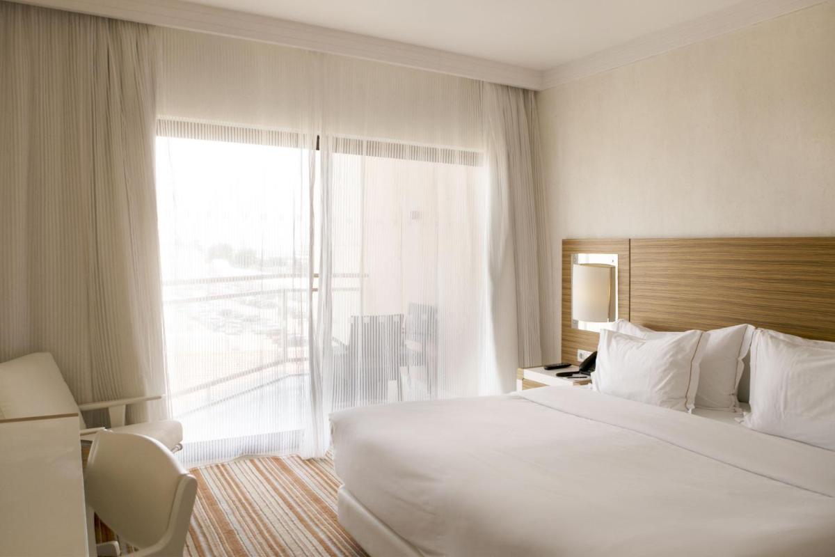 Uma cama ou camas num quarto em Real Marina Hotel & Spa