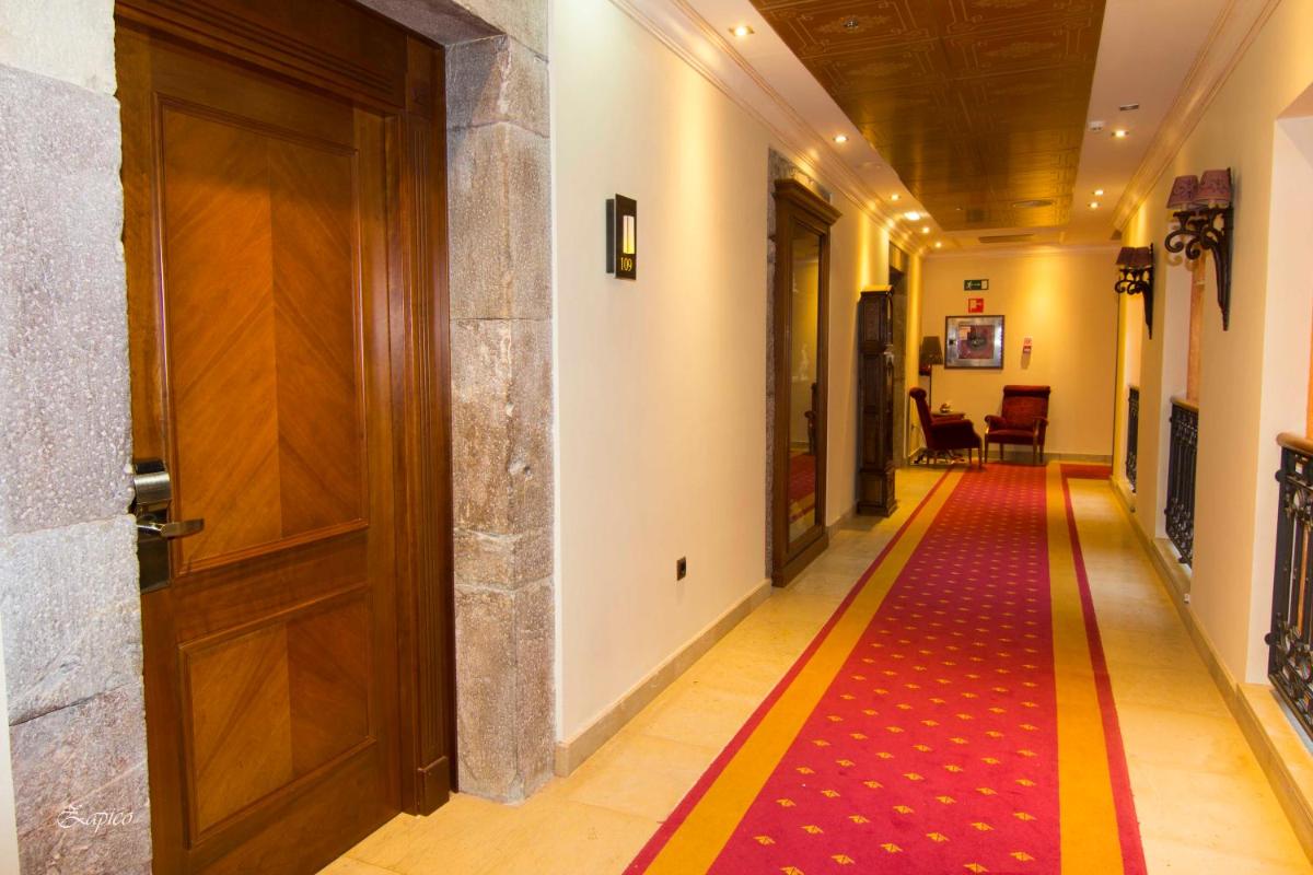 Cama o camas de una habitación en Hotel Palacio de la Magdalena