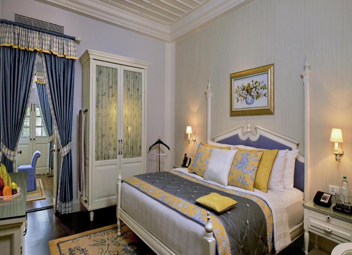 a bedroom with a large bed in a room at Welcomhotel by ITC Hotels, The Savoy, Mussoorie in Mussoorie