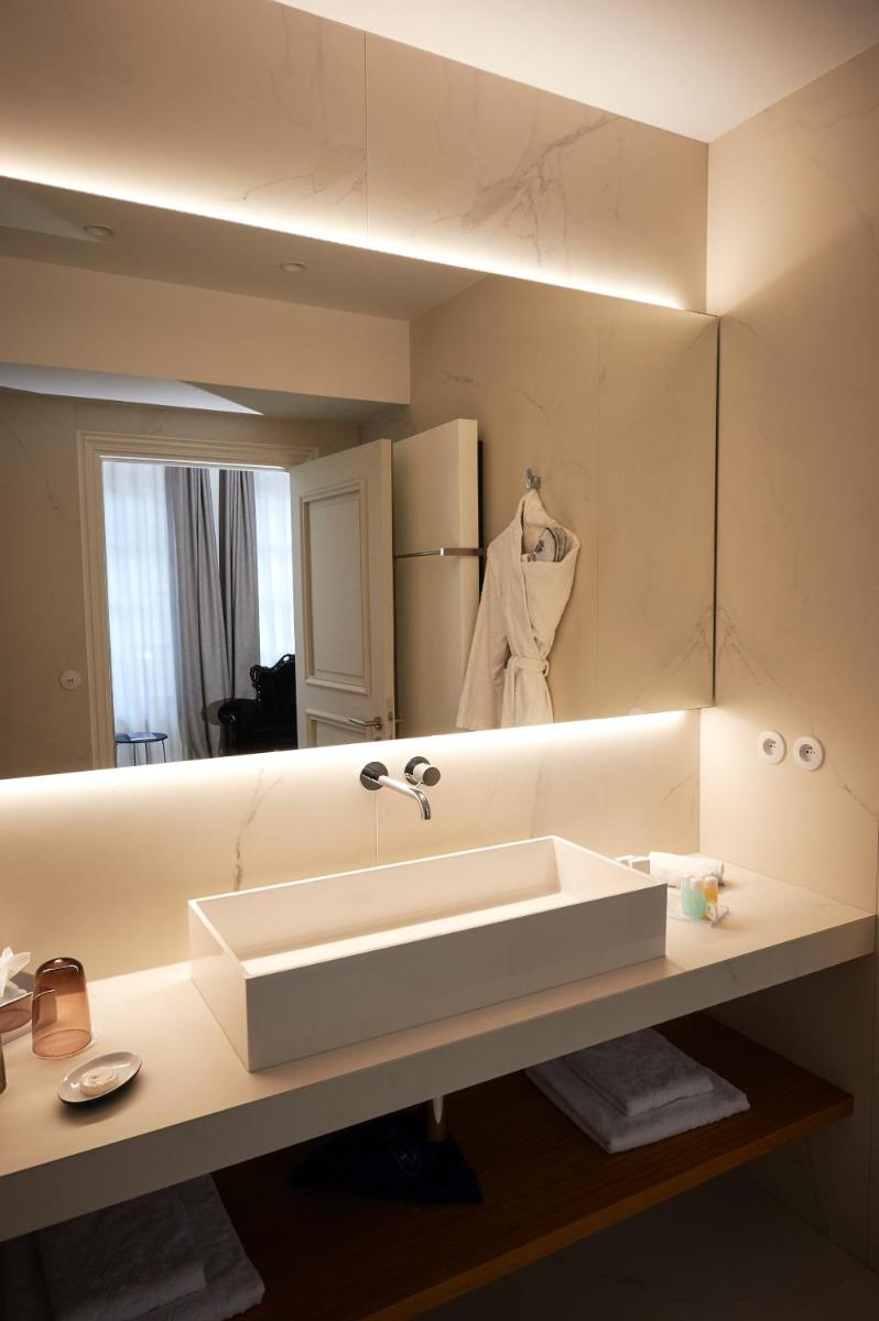 Salle de bains dans l'établissement Relais & Châteaux La Maison Des Têtes