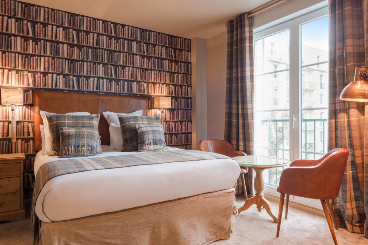 Un ou plusieurs lits dans un hébergement de l'établissement Hôtel Spa Vent d'Ouest