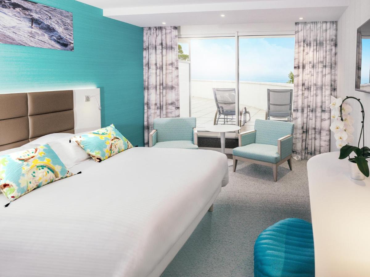 Un ou plusieurs lits dans un hébergement de l'établissement Alliance Pornic Hôtel Thalasso & Spa