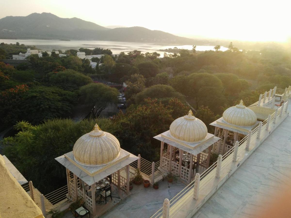 two domes on top of a building with a view at Chunda Palace in Udaipur