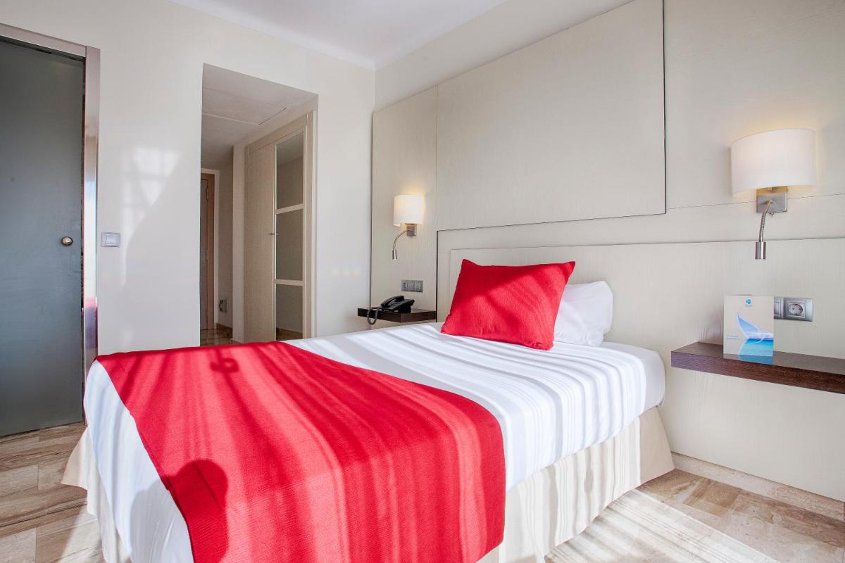 Cama o camas de una habitación en Grupotel Montecarlo