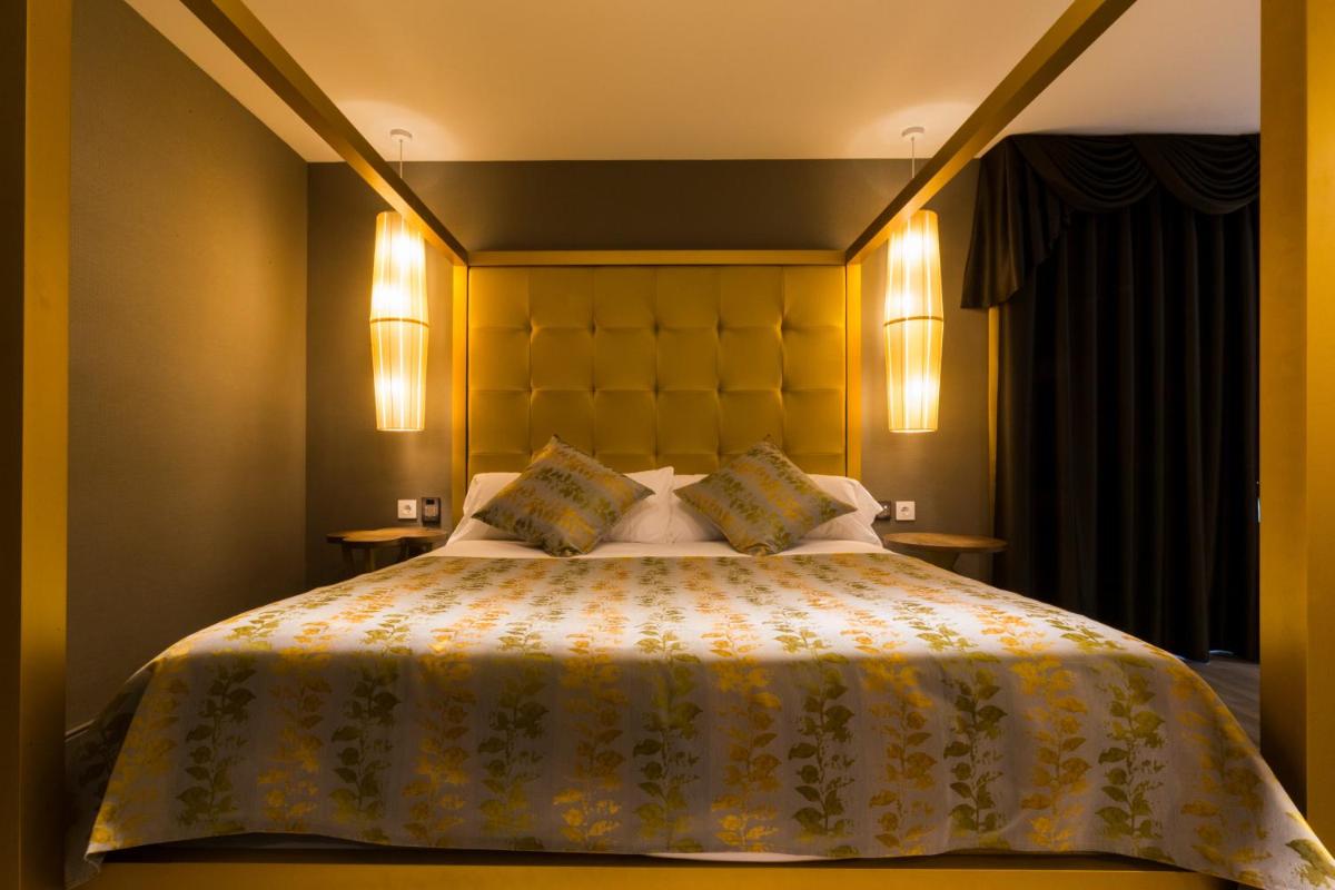 Cama o camas de una habitación en Sant Jordi Boutique Hotel