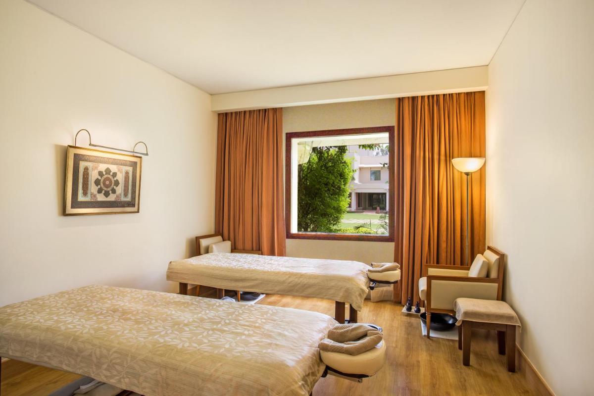 a hospital room with two beds and a window at Trident Agra in Agra