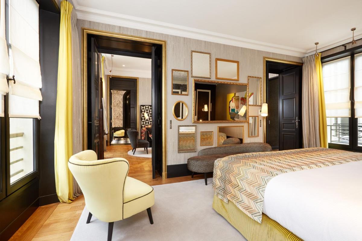 Un ou plusieurs lits dans un hébergement de l'établissement Le Pavillon de la Reine & Spa, Place des Vosges