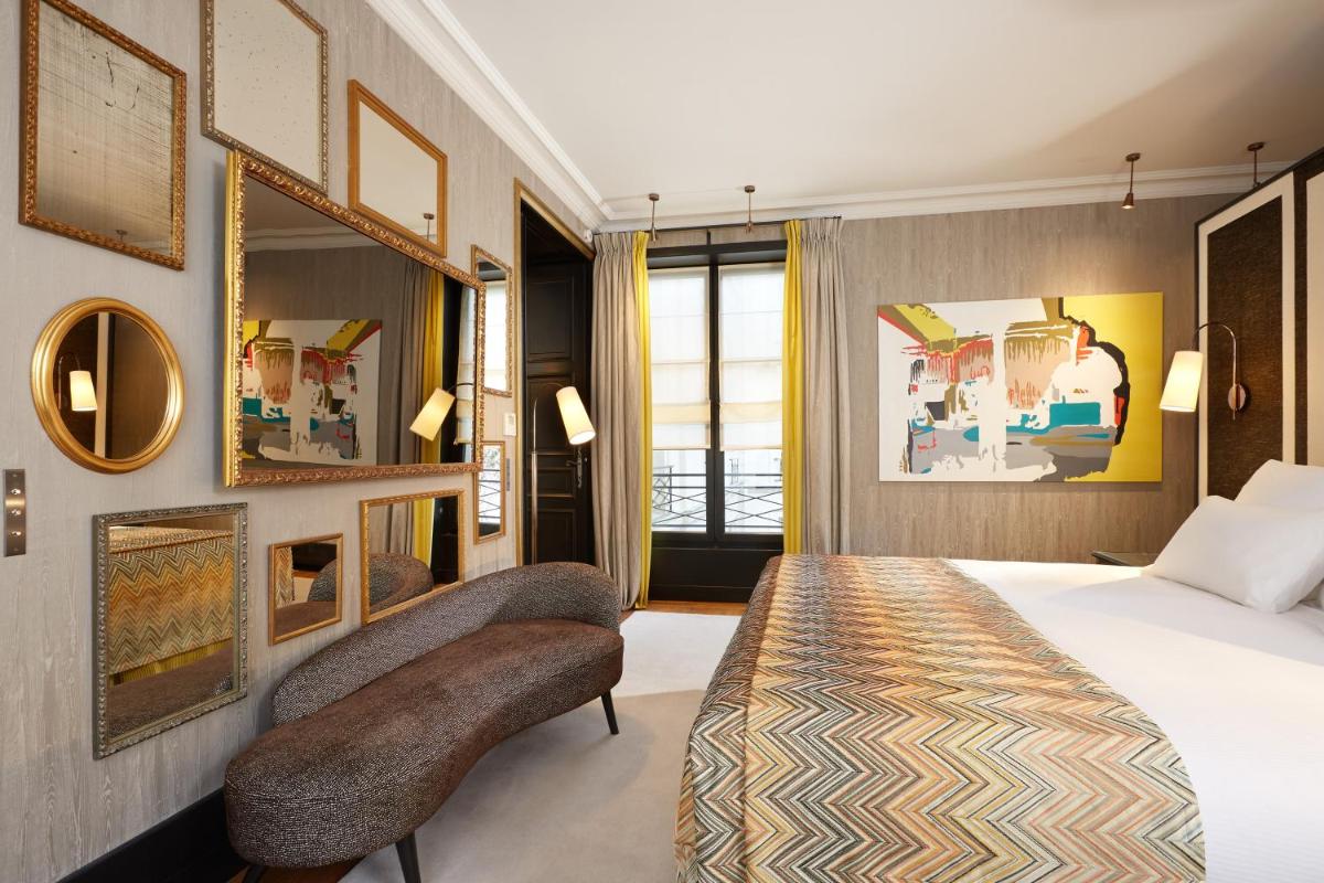 Un ou plusieurs lits dans un hébergement de l'établissement Le Pavillon de la Reine & Spa, Place des Vosges