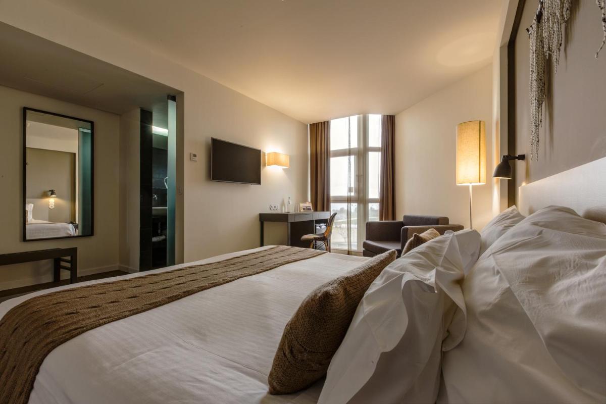 Uma cama ou camas num quarto em Puralã - Wool Valley Hotel & SPA