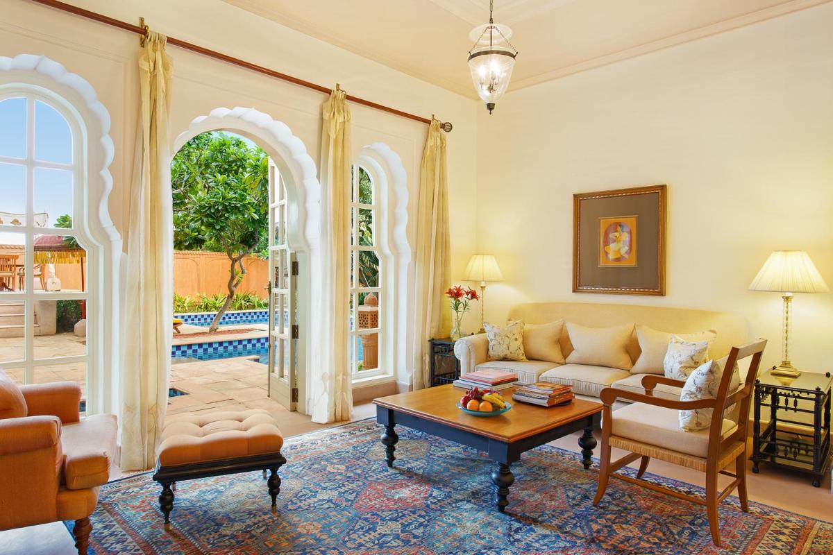 a living room with a couch and a table at The Oberoi Rajvilas Jaipur in Jaipur