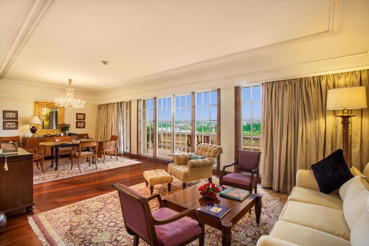 a living room with a couch and a table at The Oberoi Amarvilas Agra in Agra