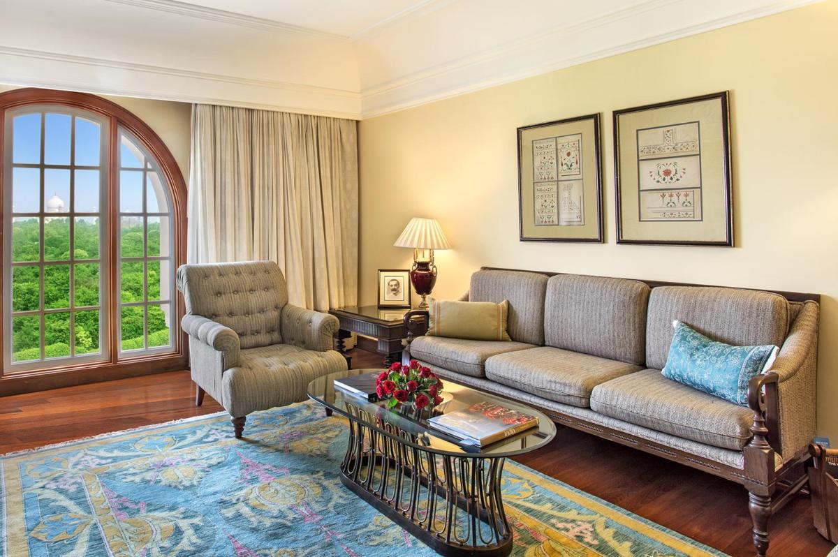 a living room with a couch and a table at The Oberoi Amarvilas Agra in Agra
