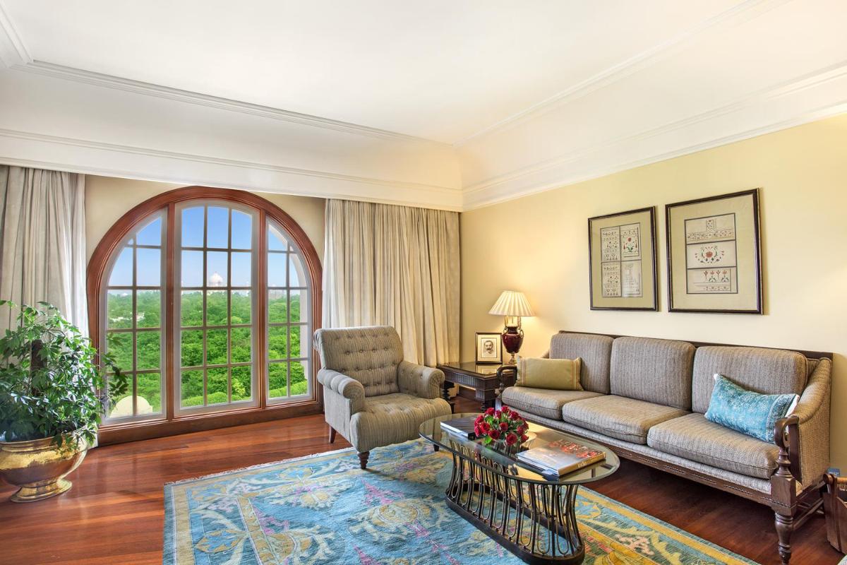 a living room with a couch and a table at The Oberoi Amarvilas Agra in Agra