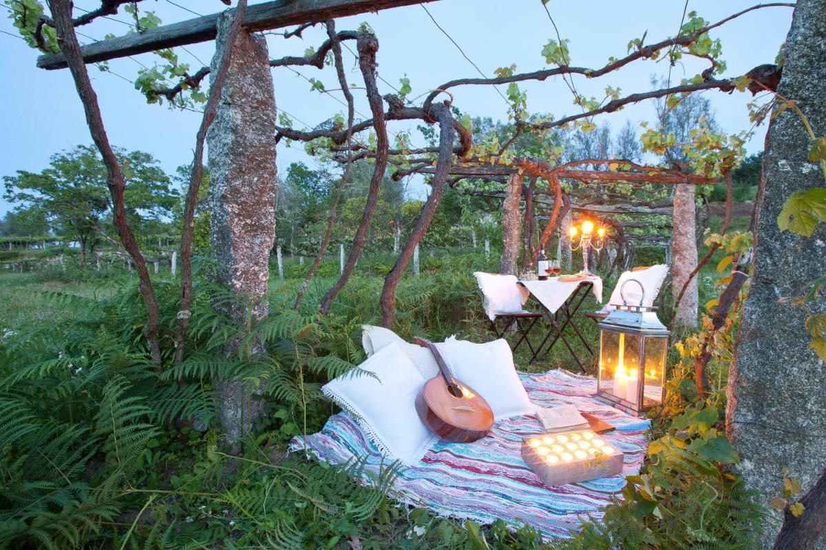 Um jardim no exterior de Carmo's Boutique Hotel - Small Luxury Hotels of the World