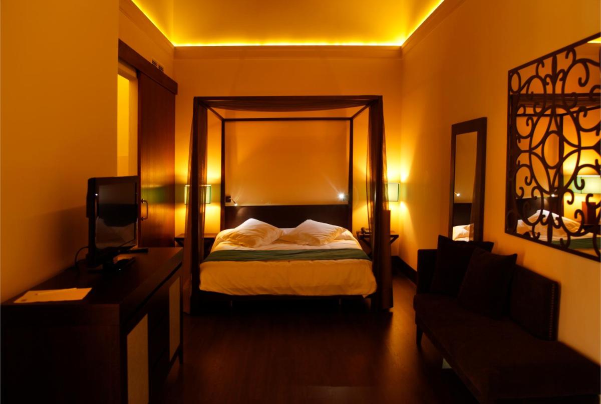 Cama o camas de una habitación en Hotel Spa Martín el Humano