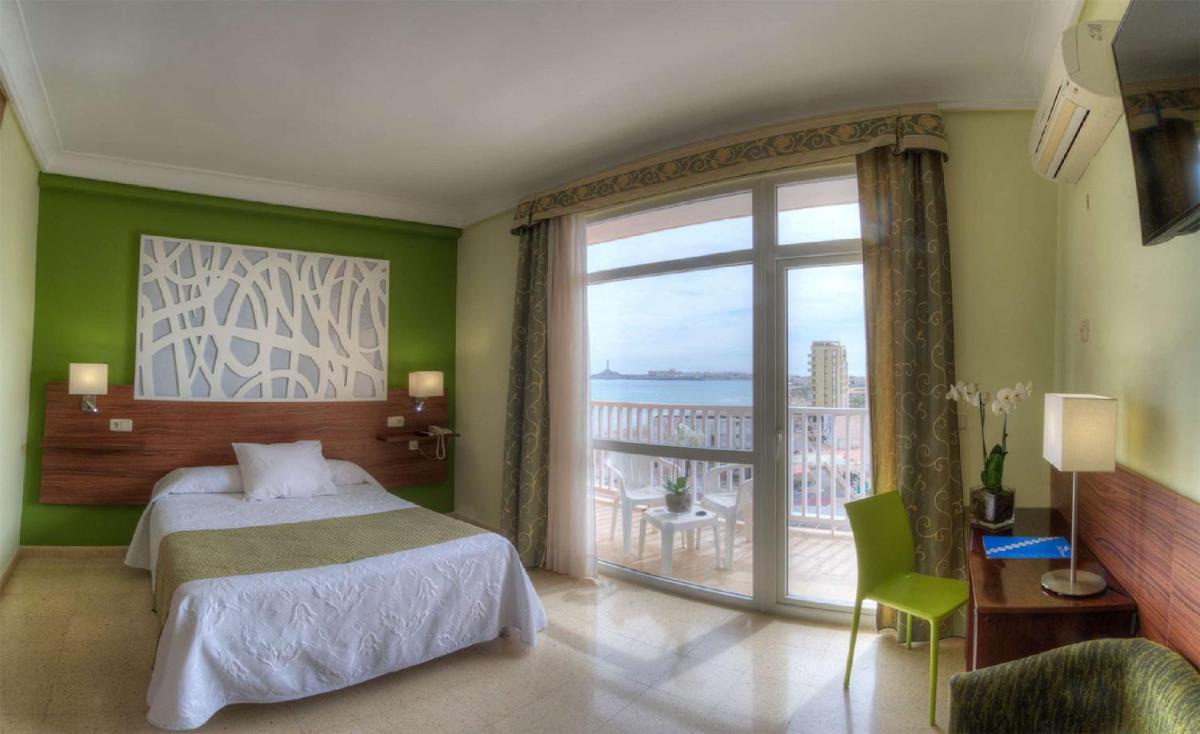 Cama o camas de una habitación en Hotel & Spa Entremares