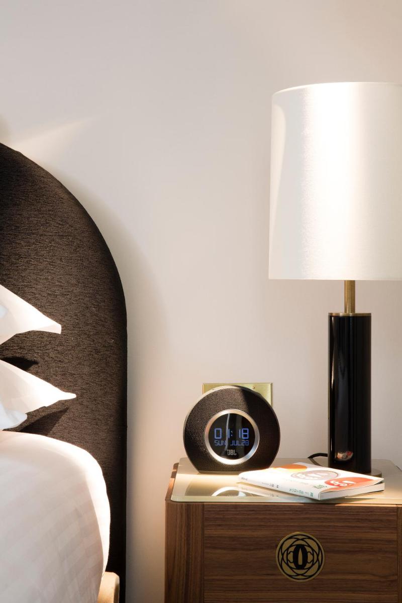 Un ou plusieurs lits dans un hébergement de l'établissement Le Tsuba Hotel