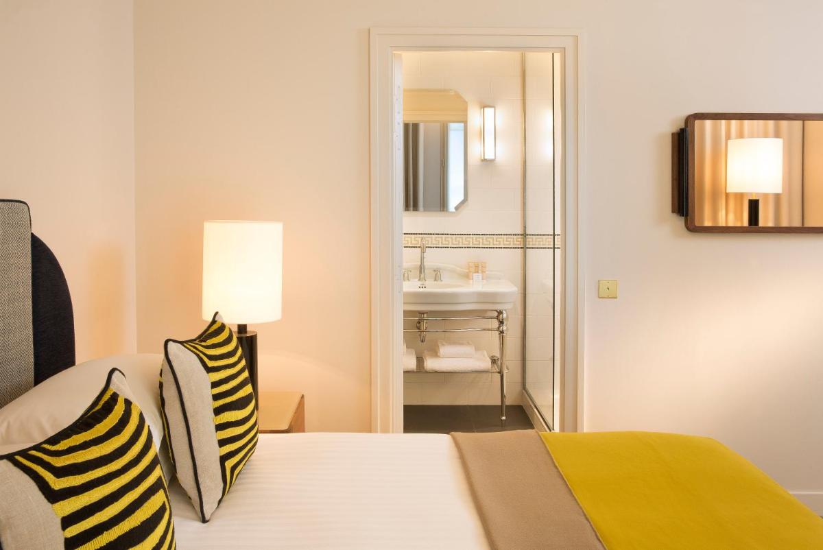 Un ou plusieurs lits dans un hébergement de l'établissement Le Tsuba Hotel
