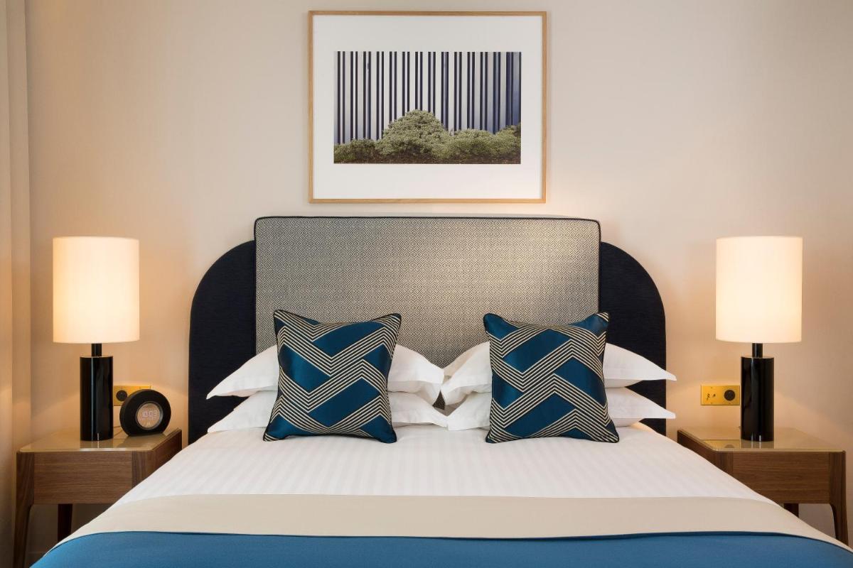 Un ou plusieurs lits dans un hébergement de l'établissement Le Tsuba Hotel