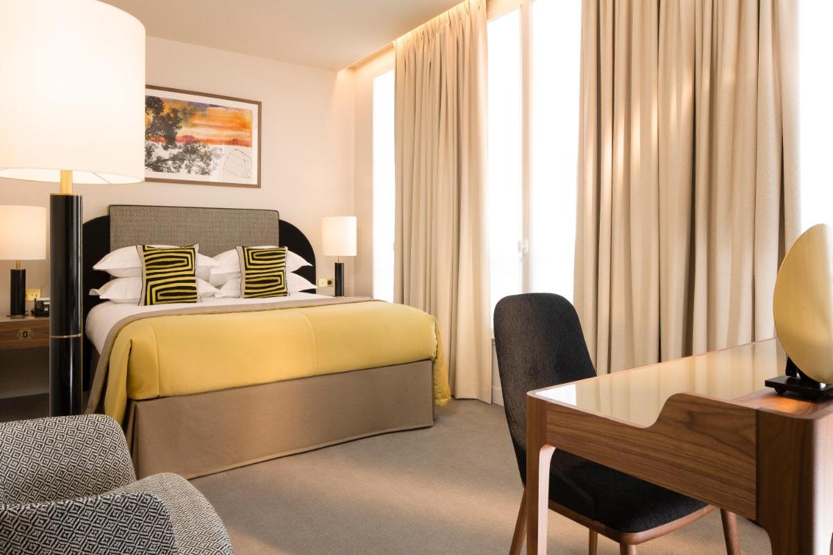 Un ou plusieurs lits dans un hébergement de l'établissement Le Tsuba Hotel