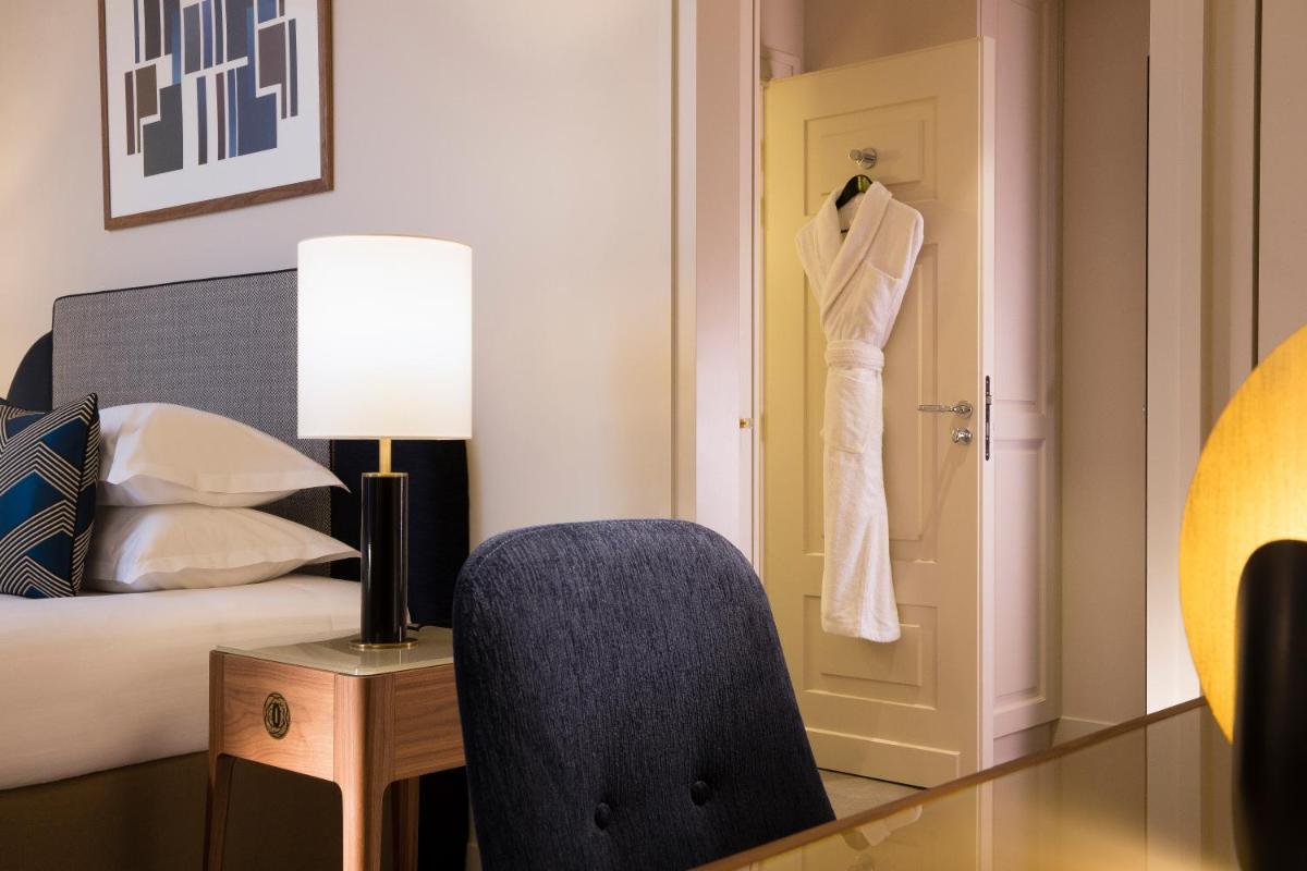 Un ou plusieurs lits dans un hébergement de l'établissement Le Tsuba Hotel