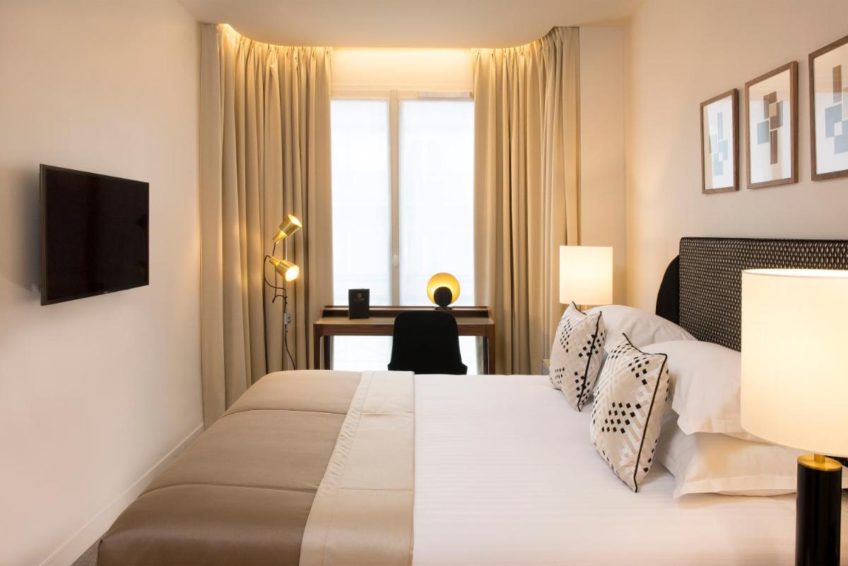 Un ou plusieurs lits dans un hébergement de l'établissement Le Tsuba Hotel