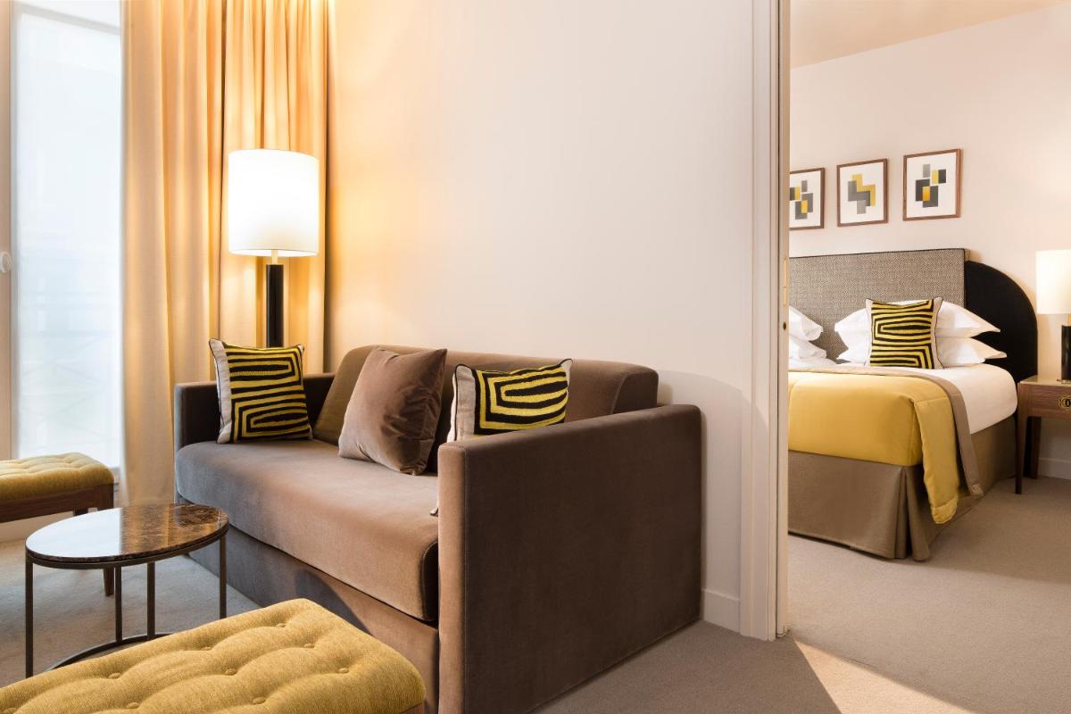 Un ou plusieurs lits dans un hébergement de l'établissement Le Tsuba Hotel