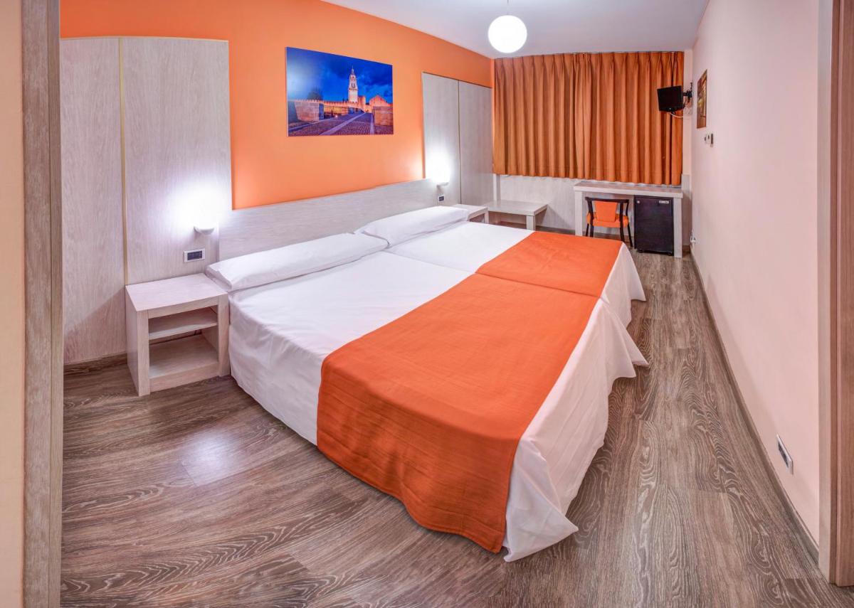 Cama o camas de una habitación en Hotel Spa Rio Ucero