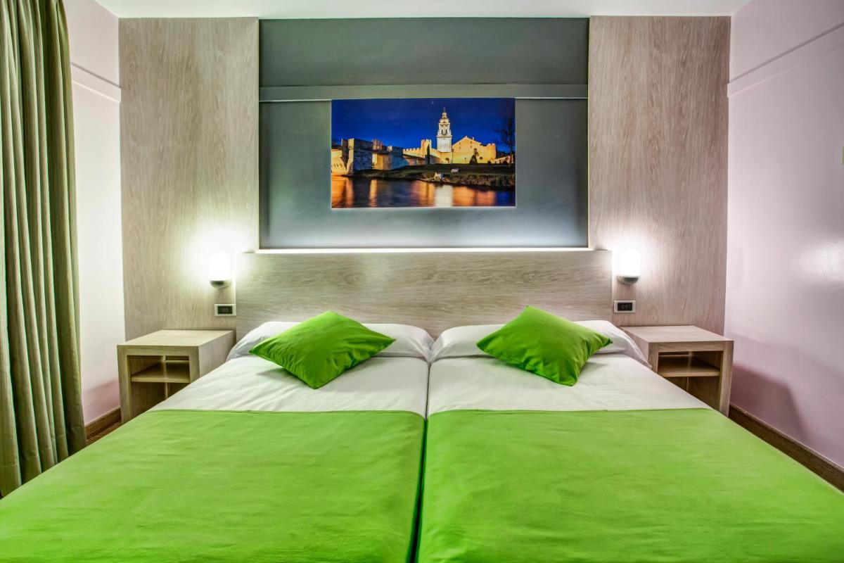 Cama o camas de una habitación en Hotel Spa Rio Ucero